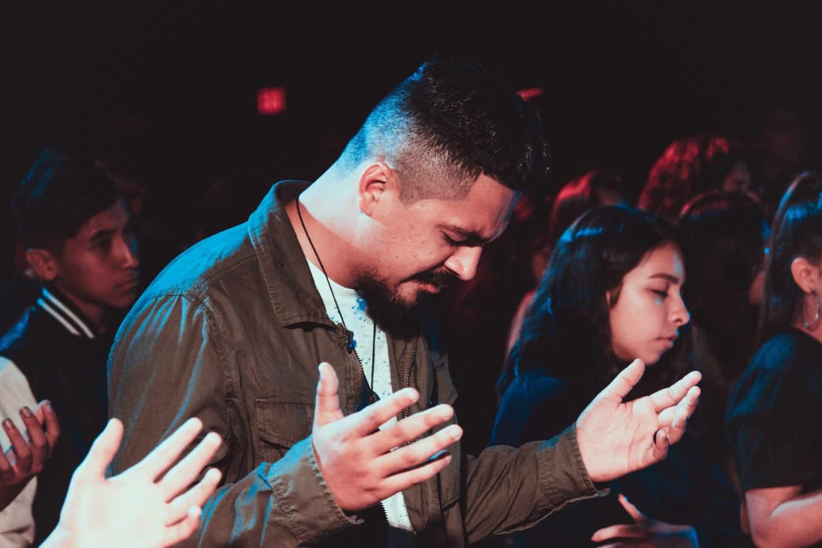 Man with hands raised in worship